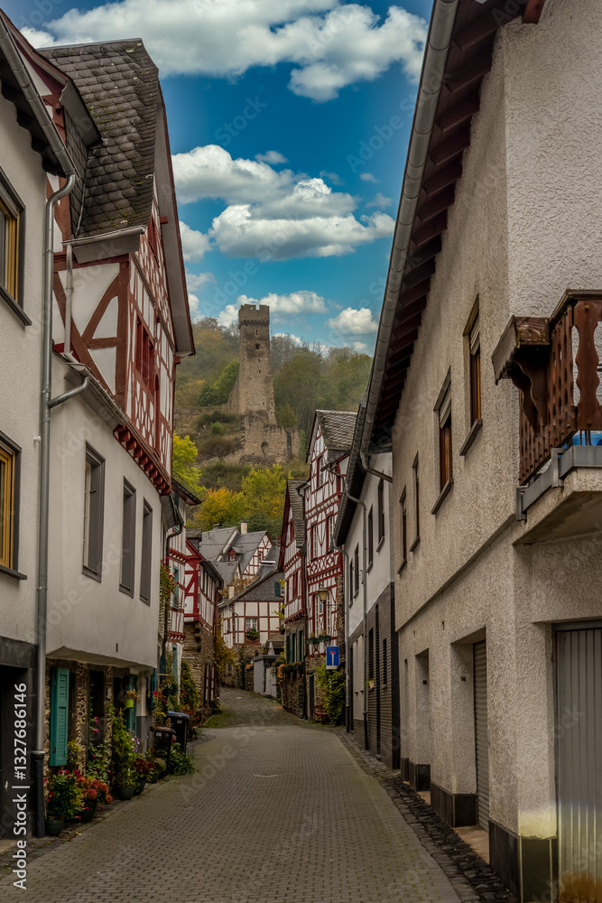 Medieval red half timbered houses in Monreal Germany on the Elzbach river under Lowenburg castle