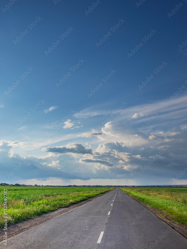 Fototapeta premium Long road with a clear blue sky above it