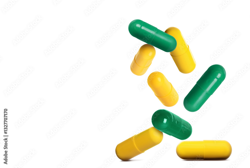 Many different pills falling on white background Many different pills falling on white background