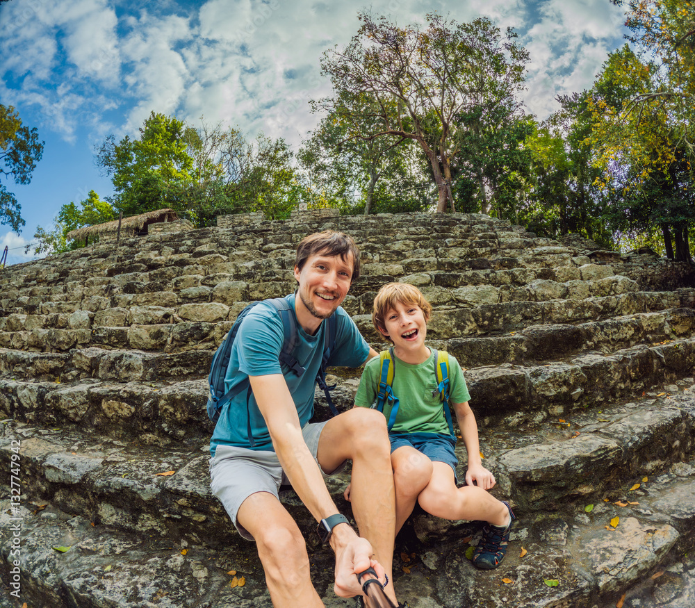Father and son tourists exploring the ancient ruins of Coba, Mexico. Family bonding, cultural heritage, and adventure travel concept in the Yucatan Peninsula