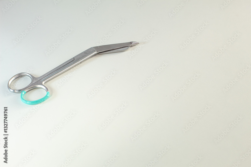Curved scissors for surgery in medicine. White background and free space for text. Curved scissors for surgery in medicine. White background and free space for text.