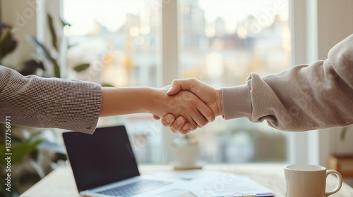 Close-up of a firm handshake in a professional business meeting