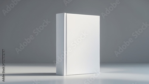White book placed on a gray background.