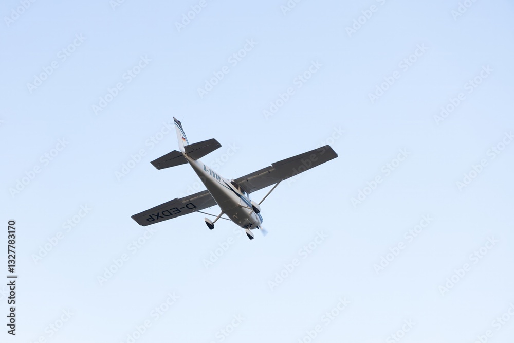 Single engine ultralight aircraft flying in the sky. empty space for insertion. Single engine ultralight aircraft flying in the sky. empty space for insertion.