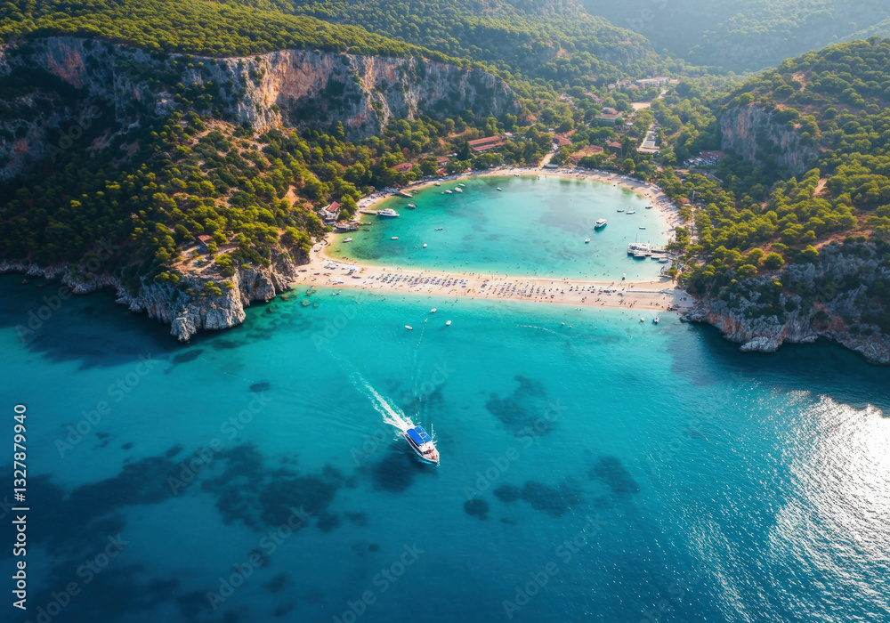 Fototapeta premium Oludeniz Blue Lagoon with turquoise sea, paradise white sand beach and tourist boat