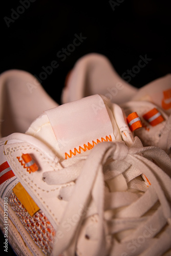 white shoes against a black background