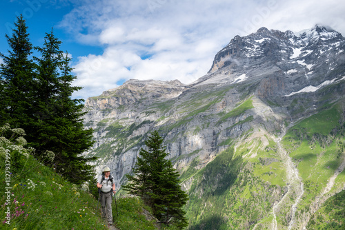 Switzerland travel - Senior man hiking the Jungfrau region of the Swiss Alps photo