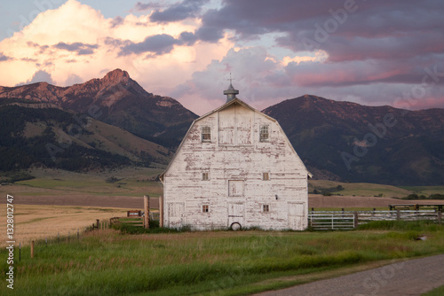 Rustic Barn in Bozeman, Montana with Vibrant Sunset and Mountain Backdrop