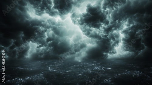 Dramatic dark clouds create an ominous atmosphere over a landscape.
