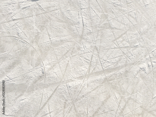 Ice background with marks from skating and hockey.