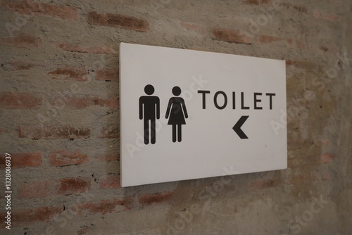 Restrooms sign with arrow