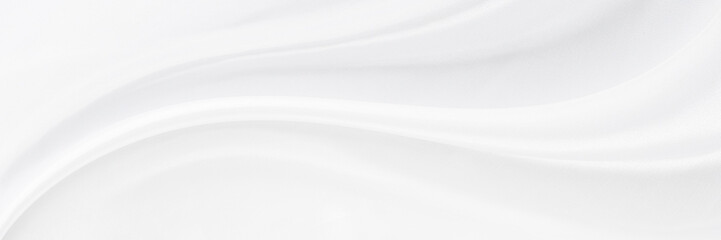 White gray satin texture that is white silver fabric silk panorama background with beautiful soft blur pattern natural.