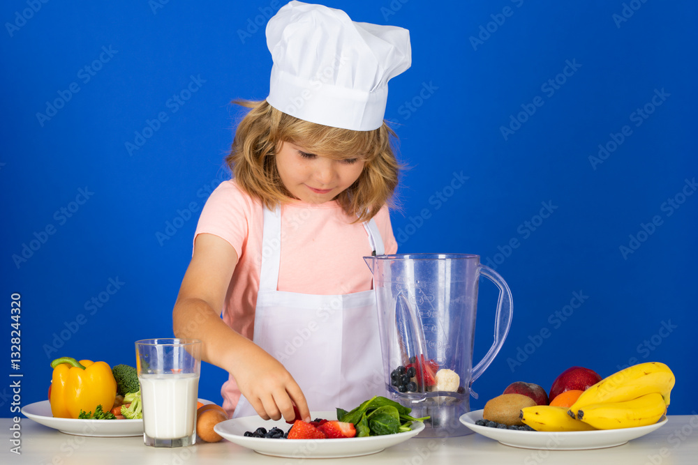 Child wearing cooker uniform and chef hat preparing vegetables on kitchen, studio portrait. Cooking, culinary and kids food concept. Child wearing cooker uniform and chef hat preparing vegetables on kitchen, studio portrait. Cooking, culinary and kids food concept.
