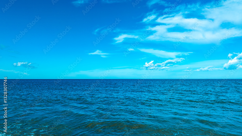 Fototapeta premium Nature of the beach and sea Summer with sunshine, sandy beaches, clear blue waters sparkling against the blue sky. On an island with good ecology and environment Background for summer vacation