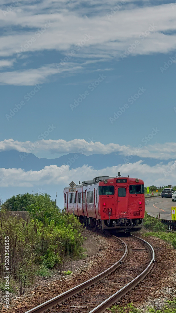 Train Passing Through Amaharashi Coast, Toyama - Distant View of Tateyama Mountains Train Passing Through Amaharashi Coast, Toyama - Distant View of Tateyama Mountains