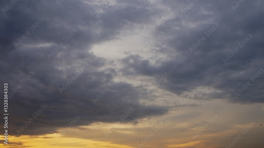 beautiful evening sky with dark clouds and yellowish sunlight indicating that night is coming beautiful evening sky with dark clouds and yellowish sunlight indicating that night is coming