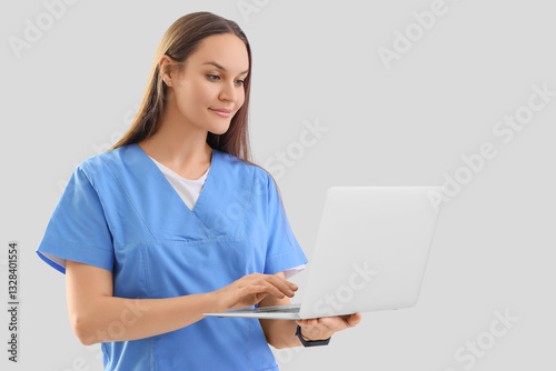 Female medical intern using...