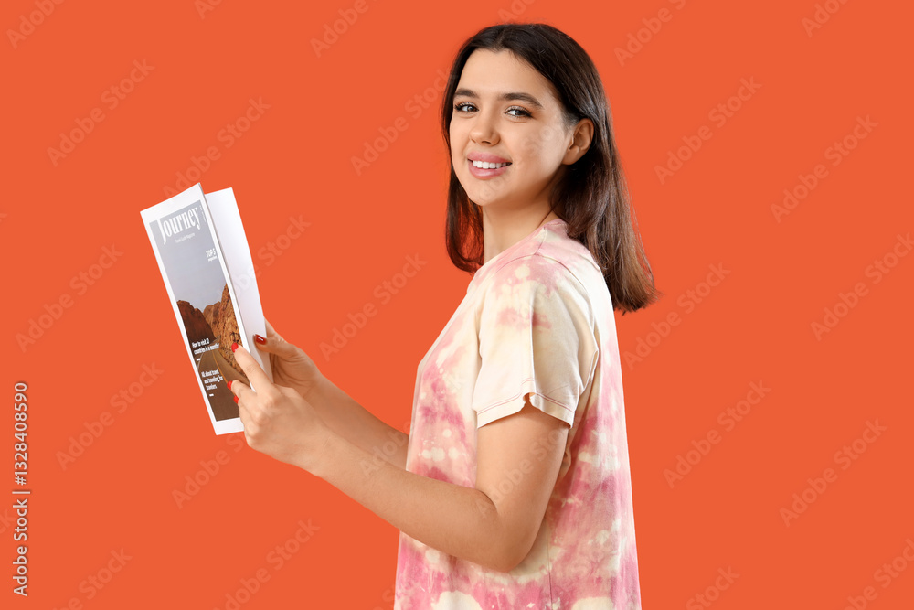 Young woman with magazine on orange background Young woman with magazine on orange background