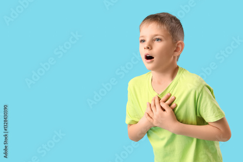 Shocked little boy on blue ...