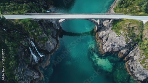 Aerial view bridge over turquoise fjord, waterfalls, green hills. Travel, tourism