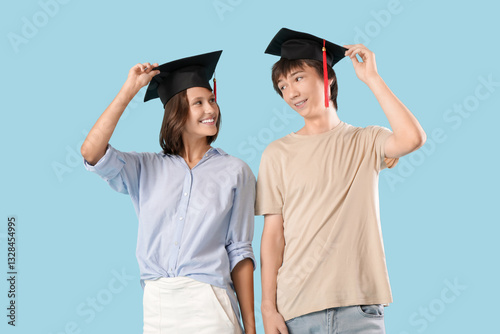 Graduating students on blue...