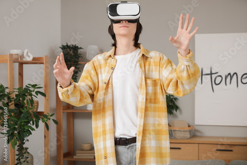 Male student using VR glass...