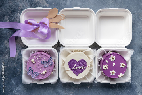 Mini Bento cake.  A new trend in confectionery. A single portion of takeaway food in lunch boxes.