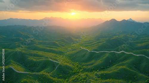 Majestic sunrise over the Great Wall winding through lush mountains