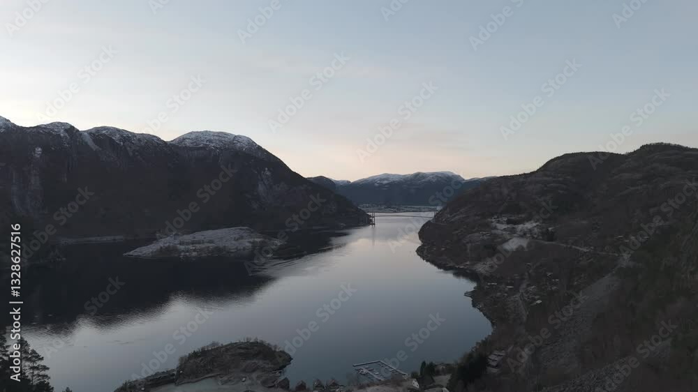 Drone shot over the valley near Forsand Norway with the Bridge over Lysefjord in the background near sunset on a clear day LOG Drone shot over the valley near Forsand Norway with the Bridge over Lysefjord in the background near sunset on a clear day LOG