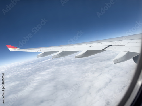 The airplane flew over the clouds.	