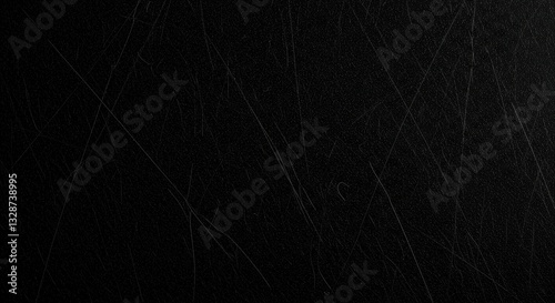 Dark surface with numerous scratches.