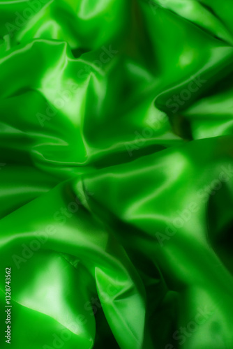 Vibrant green silky fabric with smooth folds and glossy texture. Ideal for luxury fashion, textile design, branding, nature-inspired themes, digital art, and eco-friendly product backgrounds
