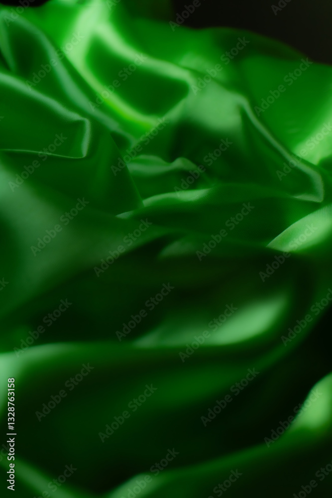 Vibrant green silky fabric with smooth folds and glossy texture. Ideal for luxury fashion, textile design, branding, nature-inspired themes, digital art, and eco-friendly product backgrounds