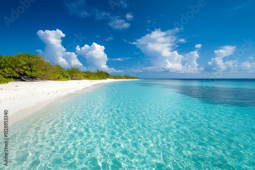 Clear turquoise waters gently lapping the pristine white sand beach under a bright blue sky filled with fluffy clouds