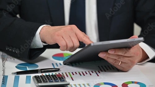 Businessman Analyzing Financial Charts and Stock Market Data
