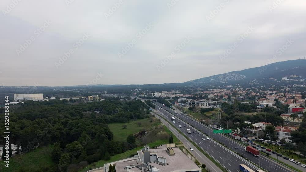 Aerial high angle view of national highway road of Greece, Varimpompi junction and some view of Penteli mountain in the background. Cloudy overcast day 4K Aerial high angle view of national highway road of Greece, Varimpompi junction and some view of Penteli mountain in the background. Cloudy overcast day 4K
