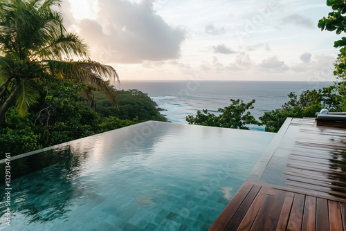 luxurious infinity pool overlooking serene ocean at sunset  surrounded by lush greenery  creates tranquil and picturesque escape