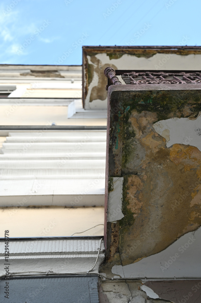 Architectural details of a weathered building captured from a low angle