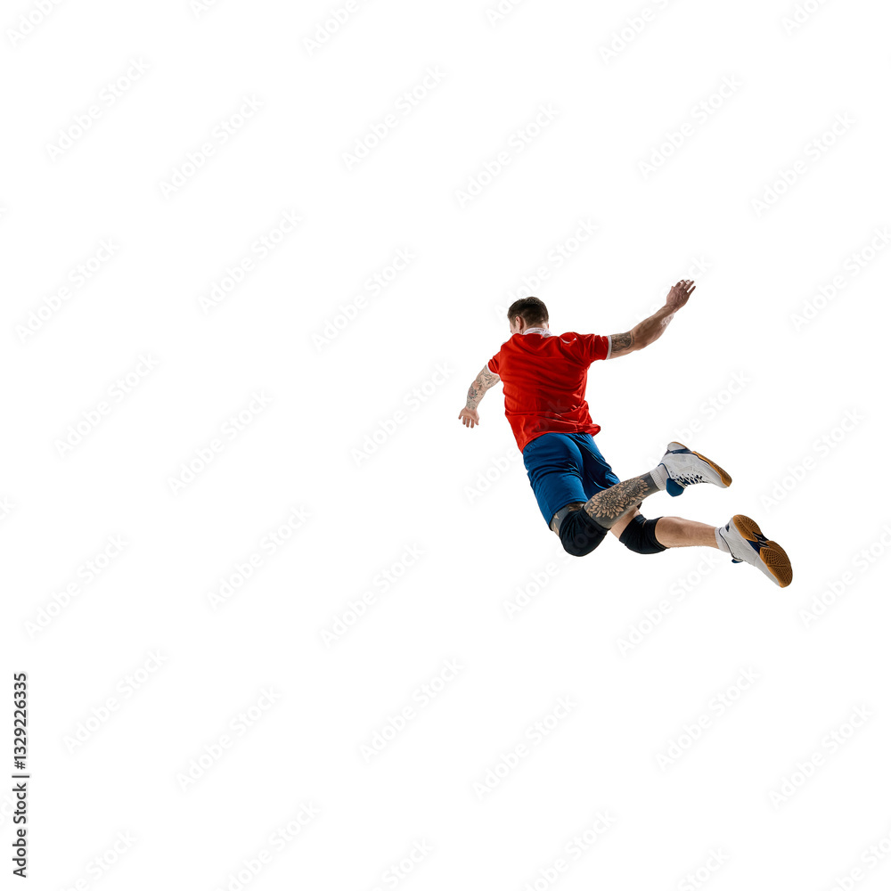 Back view image of determined athlete, male volleyball player dressed in red jersey and blue shorts, playing against white studio background. Concept of sport, competition, energy, active lifestyle Back view image of determined athlete, male volleyball player dressed in red jersey and blue shorts, playing against white studio background. Concept of sport, competition, energy, active lifestyle