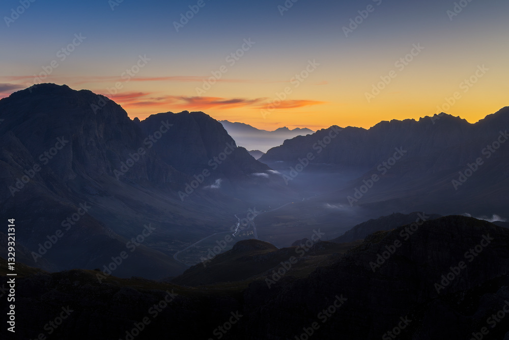 View of majestic sunrise over rugged mountains and tranquil valley, Miaspoort, Western Cape, South Africa. View of majestic sunrise over rugged mountains and tranquil valley, Miaspoort, Western Cape, South Africa.