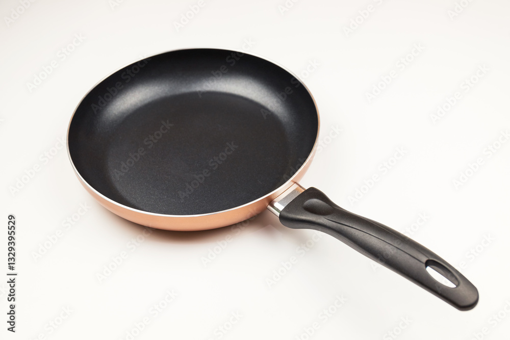 Cooking kitchenware frying pan on solid color background Cooking kitchenware frying pan on solid color background