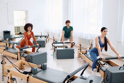 Engaging pilates session at a modern studio with dedicated participants