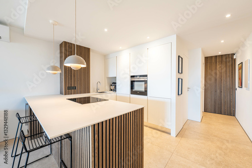 Tableau sur toile Modern open-plan kitchen with wood accents and minimalist white cabinetry