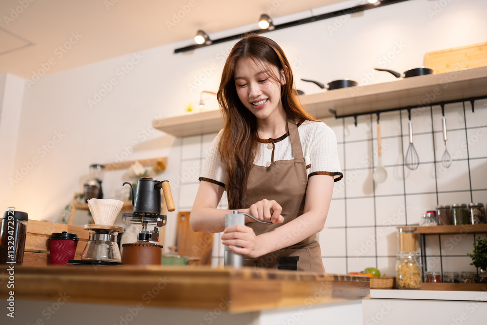 Lifestyle people, Happy woman making drip coffee in the kitchen. Lifestyle people, Happy woman making drip coffee in the kitchen.