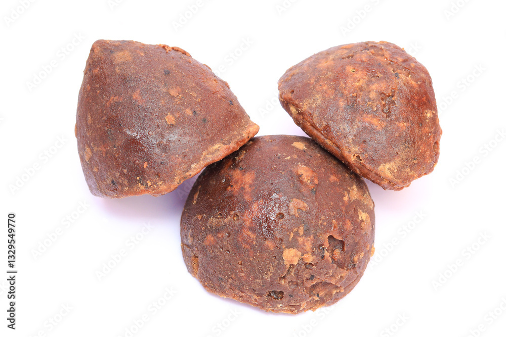 Palm jaggery isolated in a white background, south indian tamil nadu sweet made from palm jaggery Palm jaggery isolated in a white background, south indian tamil nadu sweet made from palm jaggery