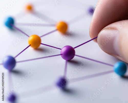 Close-up of colorful connected dots representing a network or molecular structure.