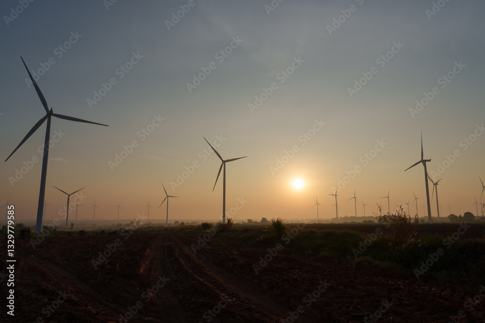 Obraz premium Wind turbines generate electricity at sunset in Europe and Asia