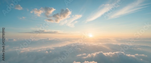 Obraz na płótnie The morning sky appeared as a bright golden vista. The sunrise is adorned with clouds of different shapes, creating a beautiful scene. w salonie