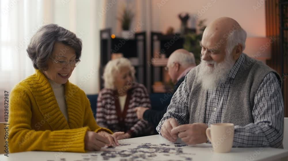 Smiling senior man and woman connecting jigsaw puzzle pieces, stimulating memory