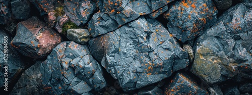 Close up of a rock wall with a variety of different sized rocks